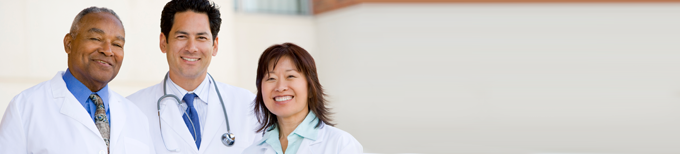 a group of physicians standing together smiling